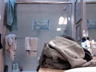 Nice brunete teen with hairy pussy taking a shower. hidden cam