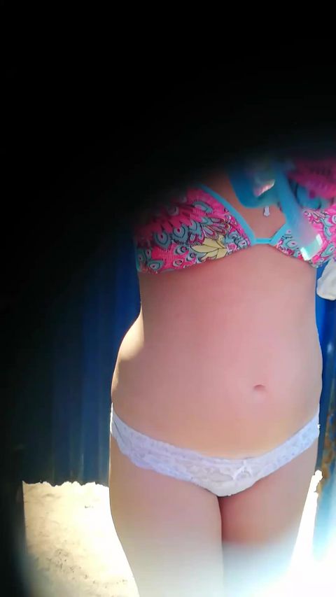 Hidden-Zone.com- Peeping through the hole in the wall in the beach cabin.